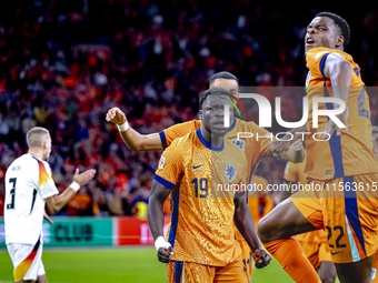 Netherlands forward Brian Brobbey and Netherlands defender Denzel Dumfries celebrate the goal during the match between the Netherlands and G...