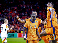 Netherlands forward Brian Brobbey and Netherlands defender Denzel Dumfries celebrate the goal during the match between the Netherlands and G...