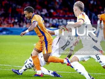 Germany midfielder Robert Andrich and Netherlands midfielder Quinten Timber during the match between the Netherlands and Germany at the Joha...