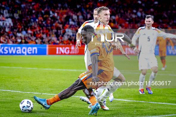 Netherlands forward Brian Brobbey and Germany defender Nico Schlotterbeck during the match between the Netherlands and Germany at the Johan...