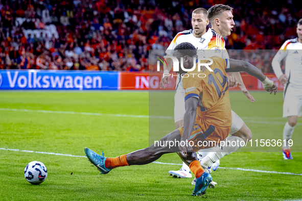 Netherlands forward Brian Brobbey and Germany defender Nico Schlotterbeck during the match between the Netherlands and Germany at the Johan...