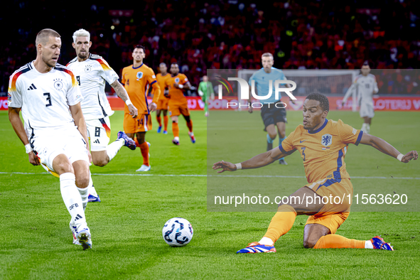 Netherlands midfielder Quinten Timber and Germany defender Waldemar Anton during the match between the Netherlands and Germany at the Johan...