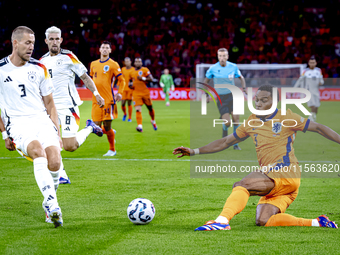 Netherlands midfielder Quinten Timber and Germany defender Waldemar Anton during the match between the Netherlands and Germany at the Johan...