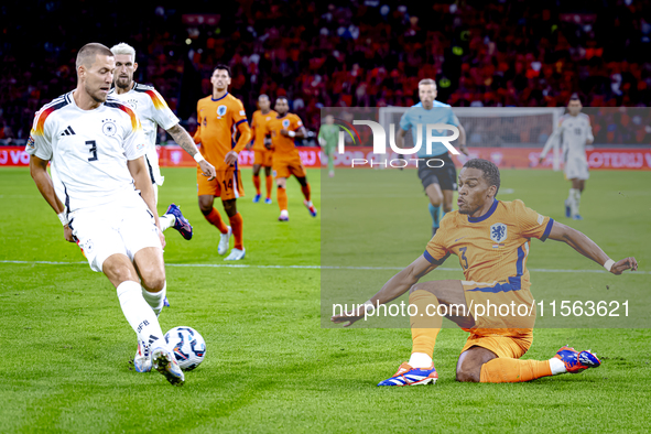 Netherlands midfielder Quinten Timber and Germany defender Waldemar Anton during the match between the Netherlands and Germany at the Johan...