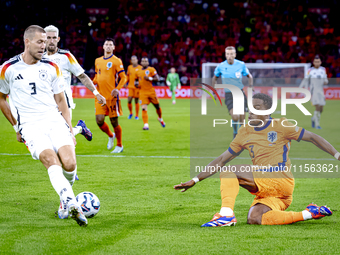 Netherlands midfielder Quinten Timber and Germany defender Waldemar Anton during the match between the Netherlands and Germany at the Johan...