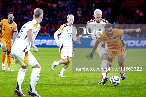 Germany midfielder Robert Andrich and Netherlands midfielder Quinten Timber during the match between the Netherlands and Germany at the Joha...