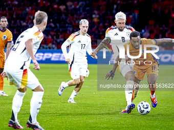 Germany midfielder Robert Andrich and Netherlands midfielder Quinten Timber during the match between the Netherlands and Germany at the Joha...