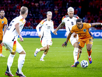 Germany midfielder Robert Andrich and Netherlands midfielder Quinten Timber during the match between the Netherlands and Germany at the Joha...