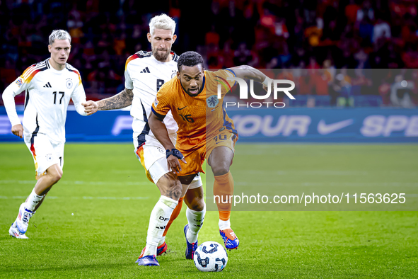 Germany midfielder Robert Andrich and Netherlands midfielder Quinten Timber during the match between the Netherlands and Germany at the Joha...