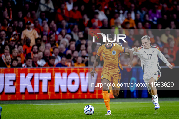 Netherlands midfielder Ryan Gravenberch and Germany midfielder Florian Wirtz during the match between the Netherlands and Germany at the Joh...