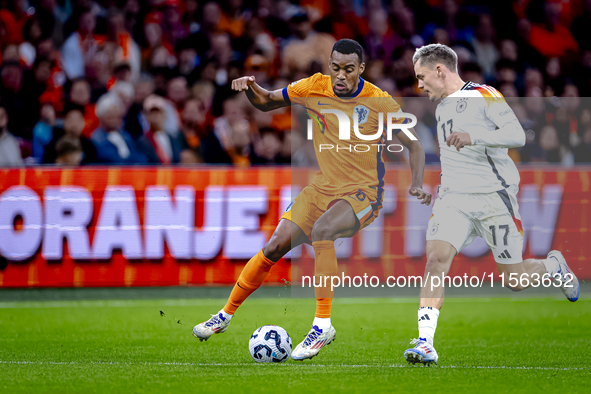 Netherlands midfielder Ryan Gravenberch and Germany midfielder Florian Wirtz during the match between the Netherlands and Germany at the Joh...