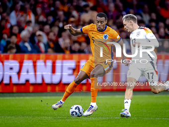 Netherlands midfielder Ryan Gravenberch and Germany midfielder Florian Wirtz during the match between the Netherlands and Germany at the Joh...