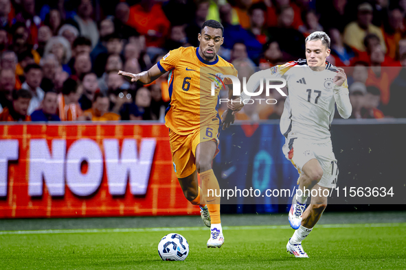 Netherlands midfielder Ryan Gravenberch and Germany midfielder Florian Wirtz during the match between the Netherlands and Germany at the Joh...