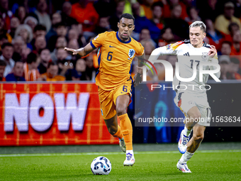 Netherlands midfielder Ryan Gravenberch and Germany midfielder Florian Wirtz during the match between the Netherlands and Germany at the Joh...