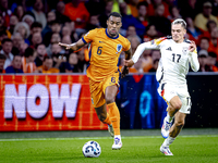 Netherlands midfielder Ryan Gravenberch and Germany midfielder Florian Wirtz during the match between the Netherlands and Germany at the Joh...