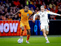 Netherlands midfielder Ryan Gravenberch and Germany midfielder Florian Wirtz during the match between the Netherlands and Germany at the Joh...