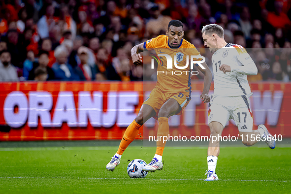 Netherlands midfielder Ryan Gravenberch and Germany midfielder Florian Wirtz during the match between the Netherlands and Germany at the Joh...