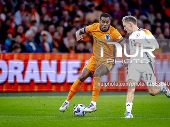 Netherlands midfielder Ryan Gravenberch and Germany midfielder Florian Wirtz during the match between the Netherlands and Germany at the Joh...