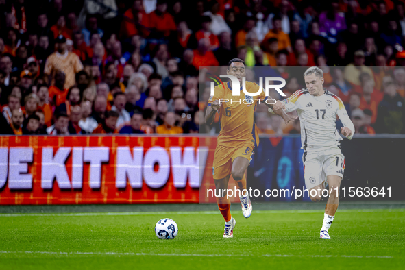 Netherlands midfielder Ryan Gravenberch and Germany midfielder Florian Wirtz during the match between the Netherlands and Germany at the Joh...