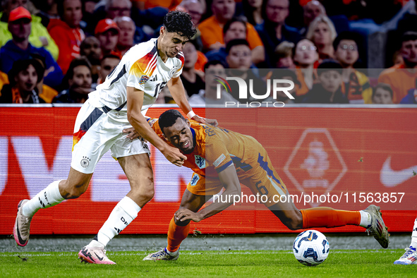 Germany defender Nico Schlotterbeck and Netherlands midfielder Ryan Gravenberch during the match between the Netherlands and Germany at the...