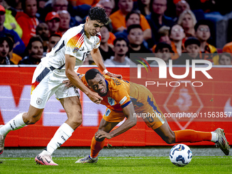 Germany defender Nico Schlotterbeck and Netherlands midfielder Ryan Gravenberch during the match between the Netherlands and Germany at the...