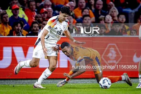 Germany defender Nico Schlotterbeck and Netherlands midfielder Ryan Gravenberch during the match between the Netherlands and Germany at the...