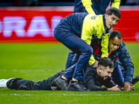 A supporter is on the pitch during the match between the Netherlands and Germany at the Johan Cruijff ArenA for the UEFA Nations League, Lea...