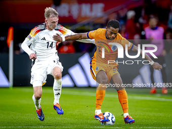 Germany forward Maximillian Beier and Netherlands defender Jurrien Timber during the match between the Netherlands and Germany at the Johan...