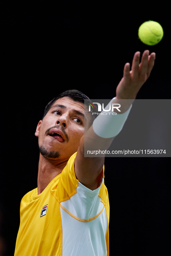 Alexei Popyrin of Australia serves against Ugo Humbert of France during the Davis Cup Group B Stage 2024 match between Australia and France...