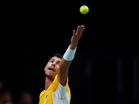 Alexei Popyrin of Australia serves against Ugo Humbert of France during the Davis Cup Group B Stage 2024 match between Australia and France...