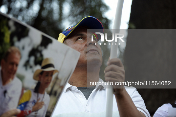 Venezuelans living in Spain take part in a gathering outside the Spanish parliament in support of opposition presidential candidate Edmundo...