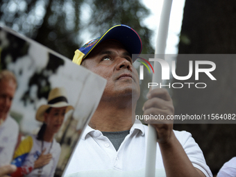 Venezuelans living in Spain take part in a gathering outside the Spanish parliament in support of opposition presidential candidate Edmundo...