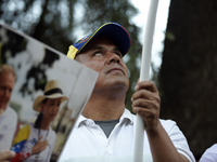 Venezuelans living in Spain take part in a gathering outside the Spanish parliament in support of opposition presidential candidate Edmundo...