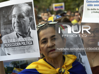 Venezuelans living in Spain take part in a gathering outside the Spanish parliament in support of opposition presidential candidate Edmundo...