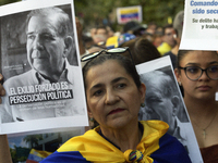 Venezuelans living in Spain take part in a gathering outside the Spanish parliament in support of opposition presidential candidate Edmundo...