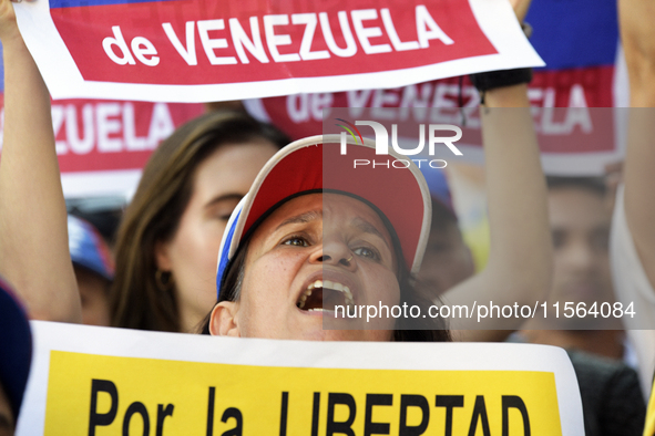 Venezuelans living in Spain take part in a gathering outside the Spanish parliament in support of opposition presidential candidate Edmundo...