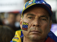 Venezuelans living in Spain take part in a gathering outside the Spanish parliament in support of opposition presidential candidate Edmundo...