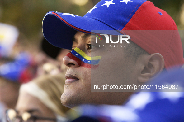 Venezuelans living in Spain take part in a gathering outside the Spanish parliament in support of opposition presidential candidate Edmundo...