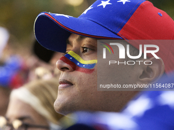 Venezuelans living in Spain take part in a gathering outside the Spanish parliament in support of opposition presidential candidate Edmundo...