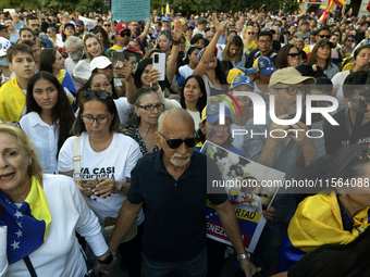 Venezuelans living in Spain take part in a gathering outside the Spanish parliament in support of opposition presidential candidate Edmundo...