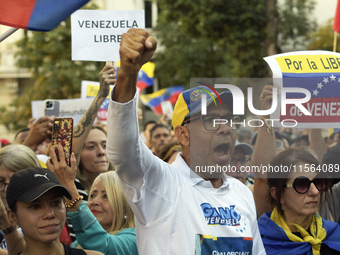 Venezuelans living in Spain take part in a gathering outside the Spanish parliament in support of opposition presidential candidate Edmundo...