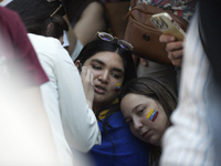 Venezuelans living in Spain take part in a gathering outside the Spanish parliament in support of opposition presidential candidate Edmundo...