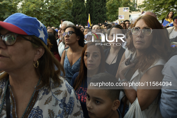 Venezuelans living in Spain take part in a gathering outside the Spanish parliament in support of opposition presidential candidate Edmundo...