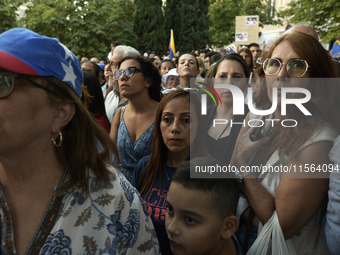 Venezuelans living in Spain take part in a gathering outside the Spanish parliament in support of opposition presidential candidate Edmundo...