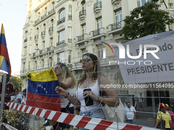 Venezuelans living in Spain take part in a gathering outside the Spanish parliament in support of opposition presidential candidate Edmundo...