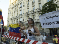 Venezuelans living in Spain take part in a gathering outside the Spanish parliament in support of opposition presidential candidate Edmundo...