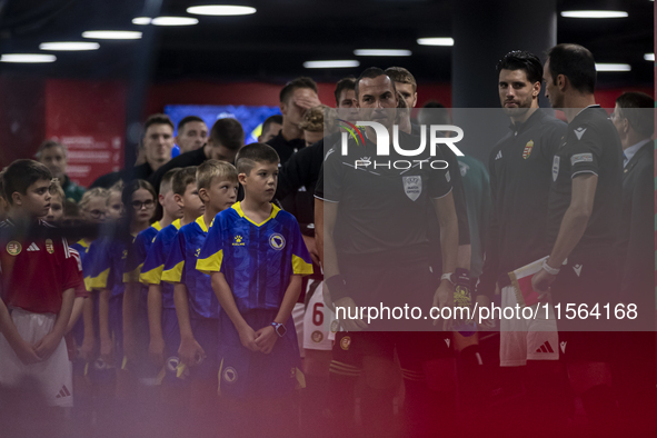 Dominik Szoboszlai and the Hungarian football team stand before the UEFA Nations League Group A3 match at Puskas Arena in Budapest, Hungary,...