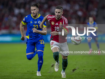 Zsolt Nagy of Hungary competes for the ball with Emin Bicakcic of Bosnia and Herzegovina during the UEFA Nations League Group A3 match at Pu...