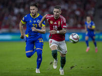 Zsolt Nagy of Hungary competes for the ball with Emin Bicakcic of Bosnia and Herzegovina during the UEFA Nations League Group A3 match at Pu...