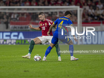 Zsolt Nagy of Hungary competes for the ball with Jusuf Gazibegovic of Bosnia and Herzegovina during the UEFA Nations League Group A3 match a...